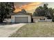 Charming single-story home with a two-car garage and well-maintained lawn, perfect for suburban living at 3728 Parkway Blvd, Land O Lakes, FL 34639