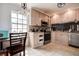A kitchen with stainless steel appliances and light wood cabinets, illuminated by a window at 3728 Parkway Blvd, Land O Lakes, FL 34639