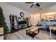 Spacious living area featuring hardwood floors, ample lighting, and a cozy sitting area at 3728 Parkway Blvd, Land O Lakes, FL 34639
