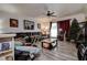 Comfortable living room featuring hardwood floors, a ceiling fan, and ample natural light at 3728 Parkway Blvd, Land O Lakes, FL 34639