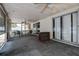 Spacious screened-in lanai with a ceiling fan and backyard views at 3728 Parkway Blvd, Land O Lakes, FL 34639