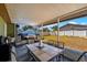 View of the covered patio with a table, chairs, and a grill at 3738 Coppertree Cir, Brandon, FL 33511