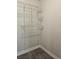 Walk-in closet features wire shelving and neutral carpet at 4043 La Pasida Ln, New Port Richey, FL 34655