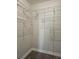 Walk-in closet with extensive wire shelving and neutral carpet at 4043 La Pasida Ln, New Port Richey, FL 34655