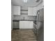 Modern kitchen featuring stainless steel appliances and stylish backsplash at 4043 La Pasida Ln, New Port Richey, FL 34655
