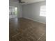 Bright living area featuring tile floors, neutral walls, and natural light at 4043 La Pasida Ln, New Port Richey, FL 34655