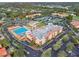 Aerial view of community featuring a pool, tennis courts, landscaped grounds, and residential buildings at 4175 Northmeadow Cir # 4175, Tampa, FL 33618