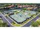 Aerial view of community featuring tennis courts, landscaped grounds, and residential buildings at 4175 Northmeadow Cir # 4175, Tampa, FL 33618