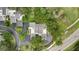 Aerial view of the home's roof and property lines, highlighting mature trees and surrounding landscape at 4175 Northmeadow Cir # 4175, Tampa, FL 33618