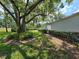 Backyard featuring landscaping and walkway leading to the side of the house at 4175 Northmeadow Cir # 4175, Tampa, FL 33618