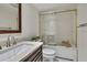 Bright bathroom featuring a vanity with granite countertop, and a shower over tub with glass sliding doors at 4175 Northmeadow Cir # 4175, Tampa, FL 33618