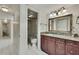 Bathroom featuring a granite vanity, large mirror, and a walk-in shower at 4175 Northmeadow Cir # 4175, Tampa, FL 33618