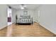 Bright bedroom boasts a ceiling fan, stylish metal bed frame and beautiful light-colored wood floors at 4175 Northmeadow Cir # 4175, Tampa, FL 33618