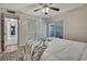 Bedroom with a view of a screened in lanai and featuring a closet with bi-fold doors at 4175 Northmeadow Cir # 4175, Tampa, FL 33618