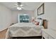 Inviting bedroom featuring a ceiling fan, natural light, wood floors and a view of the outdoors at 4175 Northmeadow Cir # 4175, Tampa, FL 33618