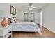 Bedroom with wood floors, built-in closet and view to the ensuite bathroom at 4175 Northmeadow Cir # 4175, Tampa, FL 33618