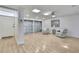 Bright bonus room features light hardwood flooring, ample natural light, and sitting area at 4175 Northmeadow Cir # 4175, Tampa, FL 33618