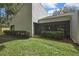 Back exterior of house showing screen lanai with golf course in the background at 4175 Northmeadow Cir # 4175, Tampa, FL 33618