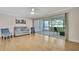Bright living room with neutral walls, light wood floors, and sliding glass doors to the patio at 4175 Northmeadow Cir # 4175, Tampa, FL 33618