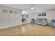 Spacious living room with wood floors, views into the dining area, and neutral wall color at 4175 Northmeadow Cir # 4175, Tampa, FL 33618