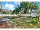 Large fenced backyard with mature shade tree at 4310 S Coolidge Ave, Tampa, FL 33611