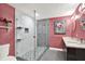 Modern bathroom features a glass walk-in shower and double vanity with elegant finishes at 4310 S Coolidge Ave, Tampa, FL 33611