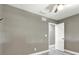 Neutral bedroom with ceiling fan, and light wood-look floors at 4310 S Coolidge Ave, Tampa, FL 33611