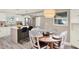 Bright kitchen with center island adjacent to a dining area with seating for six at 4310 S Coolidge Ave, Tampa, FL 33611