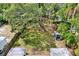 A backyard featuring a sprawling lawn, a storage shed, and a wood fence offering privacy and ample space at 511 San Jose Dr, Dunedin, FL 34698