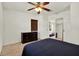 Bedroom featuring a ceiling fan, closet, and ensuite with coordinated bedding and furniture at 511 San Jose Dr, Dunedin, FL 34698