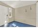 Bright bonus room with painted floors, a window, and an exterior door at 511 San Jose Dr, Dunedin, FL 34698