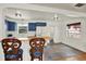 Open kitchen featuring a breakfast bar, blue cabinets, stainless steel appliances and a window at 511 San Jose Dr, Dunedin, FL 34698