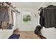 Walk-in closet featuring installed wire racks and a window with a view of the backyard at 511 San Jose Dr, Dunedin, FL 34698
