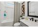 Bathroom featuring a shower/tub combination and a gray vanity with a white sink at 5133 Harbinger Rd, Spring Hill, FL 34608
