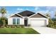 Charming one-story home with a well-manicured lawn and an attached two-car garage at 5133 Harbinger Rd, Spring Hill, FL 34608