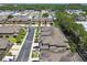 Aerial of townhomes in the neighborhood with sidewalks, lawns, and street parking at 5150 Bay Isle Cir, Clearwater, FL 33760