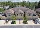 Aerial view of townhomes complex showing well-maintained lawns and landscaping and parking at 5150 Bay Isle Cir, Clearwater, FL 33760