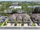 Aerial view of townhome complex showcasing well-maintained lawns and landscaping at 5150 Bay Isle Cir, Clearwater, FL 33760
