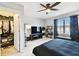 Bedroom with a closet, ceiling fan, television, and natural light from the window at 5150 Bay Isle Cir, Clearwater, FL 33760