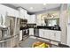 Well-equipped eat-in kitchen featuring stainless steel appliances and an open layout perfect for cooking and socializing at 5150 Bay Isle Cir, Clearwater, FL 33760
