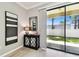 Stylish living area featuring a sliding glass door to the outdoors and modern decor at 5150 Bay Isle Cir, Clearwater, FL 33760