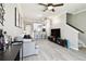 Open concept living room flows into the kitchen and features luxury vinyl plank flooring and a ceiling fan at 5150 Bay Isle Cir, Clearwater, FL 33760