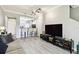 Open concept living room flows into the kitchen and features luxury vinyl plank flooring and a ceiling fan at 5150 Bay Isle Cir, Clearwater, FL 33760