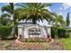 Community entrance sign for Bay Isle Landings with landscaping and palm trees at 5150 Bay Isle Cir, Clearwater, FL 33760