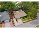 Aerial view of the property showcasing its location, well-maintained yard, and proximity to other homes at 5600 Bay Pines Lakes Blvd, St Petersburg, FL 33708