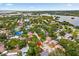 Aerial view highlighting property location near a body of water and surrounding neighborhood at 5600 Bay Pines Lakes Blvd, St Petersburg, FL 33708