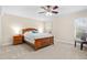 Relaxing bedroom with neutral carpet, ceiling fan, and a cozy bed for restful nights at 5600 Bay Pines Lakes Blvd, St Petersburg, FL 33708