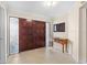 Foyer featuring tile flooring, a wooden console table, and decorative glass sidelights at 5600 Bay Pines Lakes Blvd, St Petersburg, FL 33708