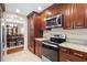 Well-equipped kitchen features stainless steel appliances and granite countertops at 5600 Bay Pines Lakes Blvd, St Petersburg, FL 33708