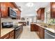 Spacious kitchen featuring stainless steel appliances and granite countertops at 5600 Bay Pines Lakes Blvd, St Petersburg, FL 33708